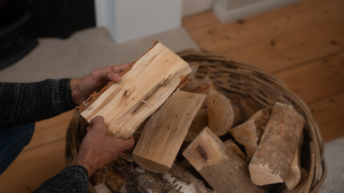 Coals2U by Homefire Firewood. What is the better choice? Main holding Homefire kiln-dried firewood logs above basket.