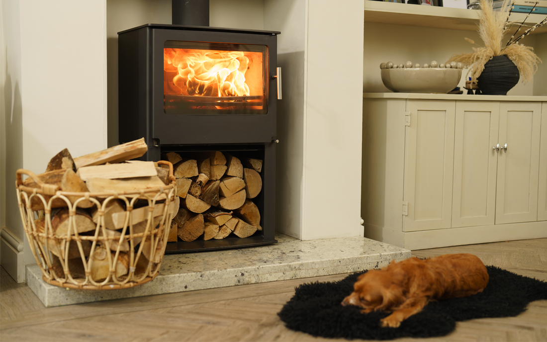 Homfire kiln dried logs stacked neatly in front of a log burner